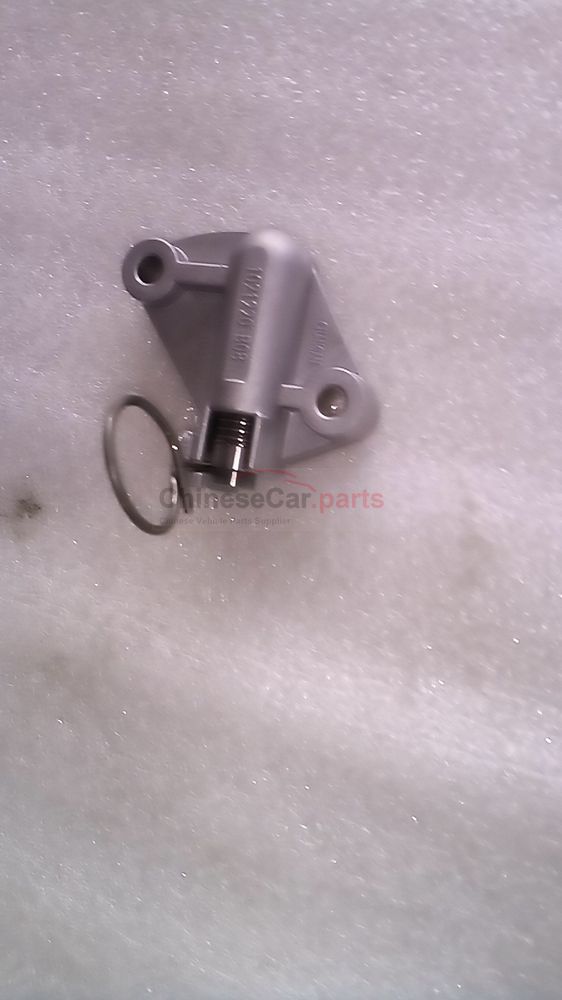 Timing chain tensioner adjuster