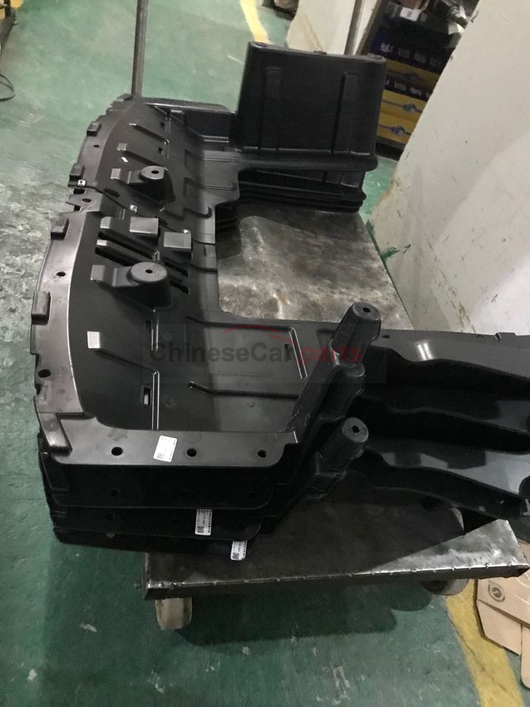 Compressor pulley side guard plate